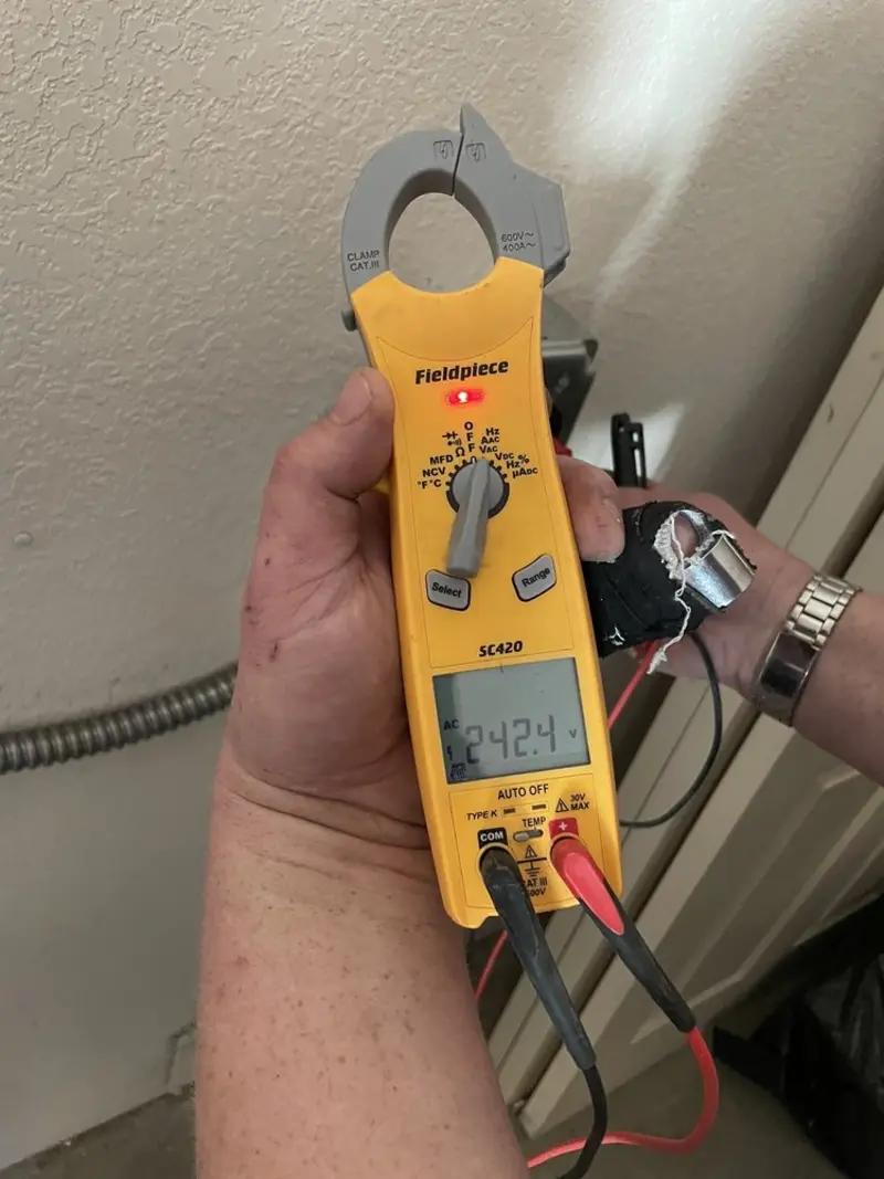 Voltage testing with clamp meter during Recessed Lighting Installation in Parkville
